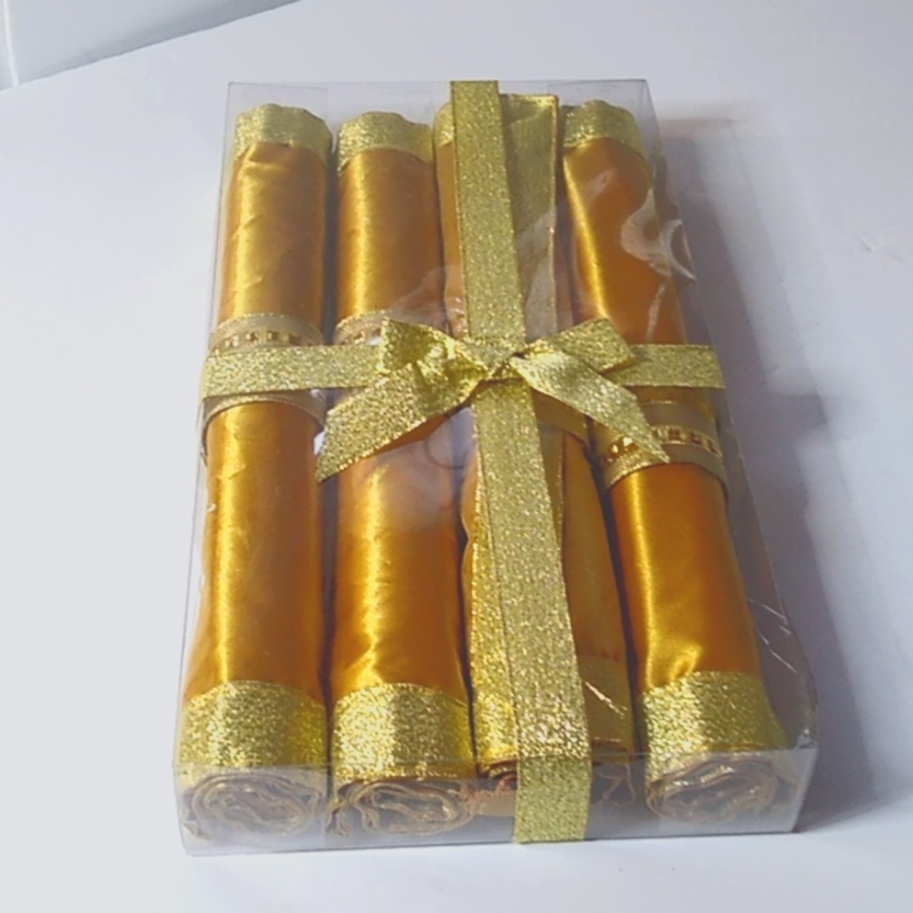 Set of 4 Napkin & Placemat set  NIB Gold color with gold metallic trim . 20.00